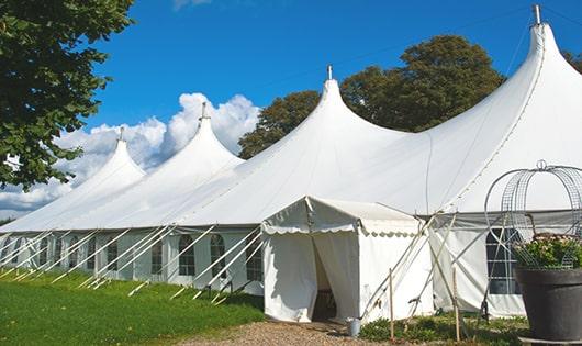 a line of sleek and modern portable toilets ready for use at an upscale corporate event in Garwood